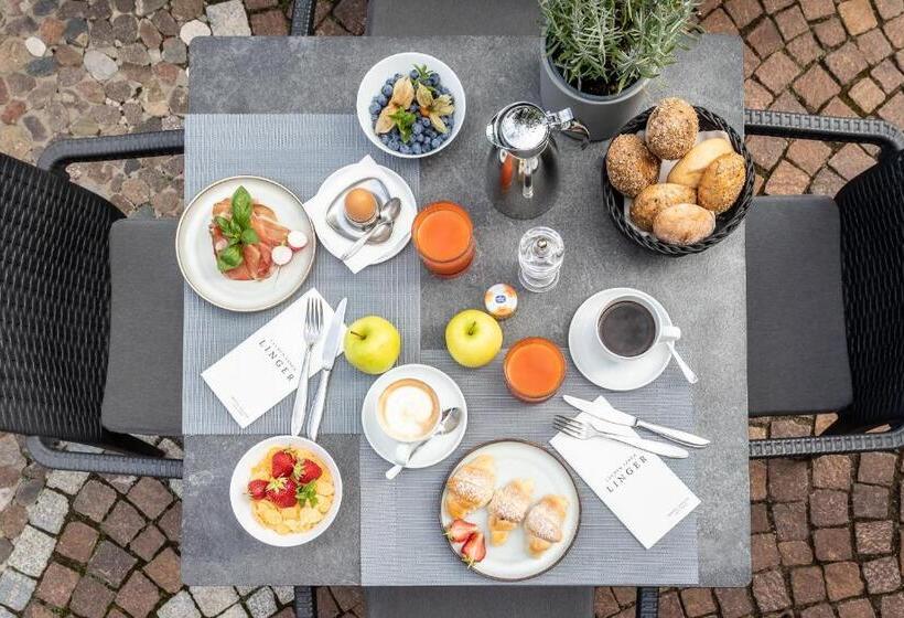 Отель Lingers Suites & Residence