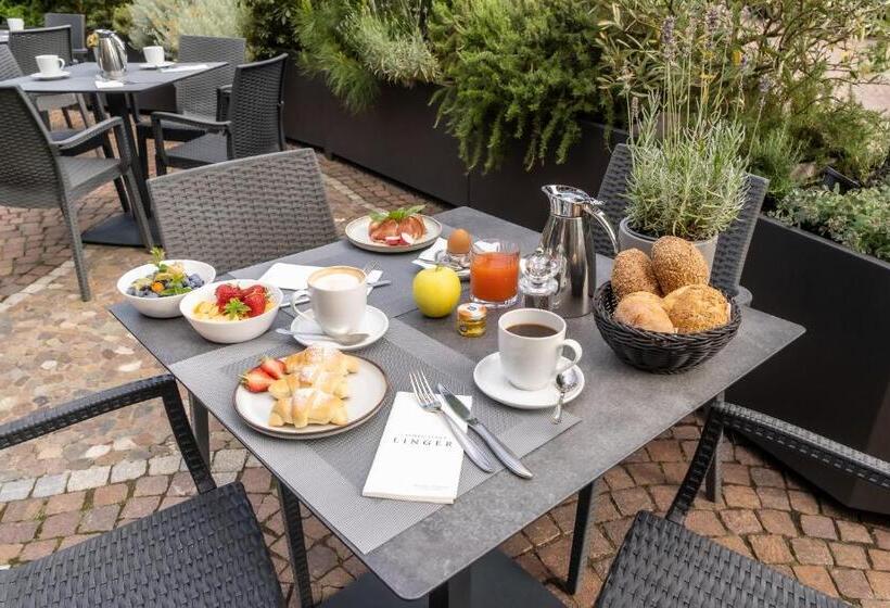 Отель Lingers Suites & Residence