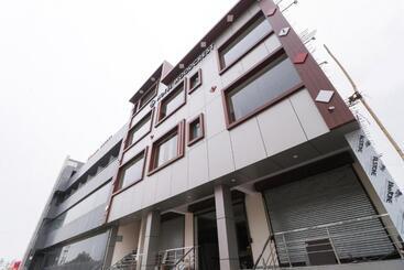 Capital O Hotel Woods In