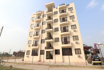 Hôtel Capital O 27911 Woodland Garden Suites