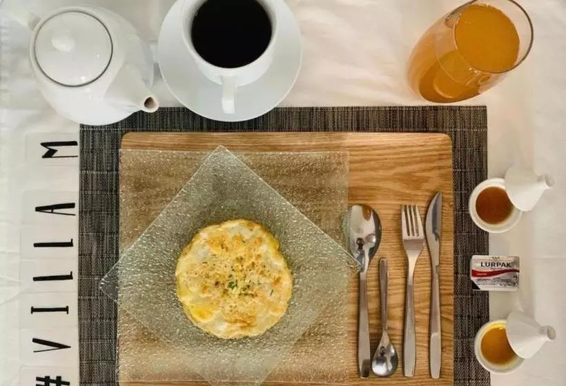 تختخواب و صبحانه La Villa M