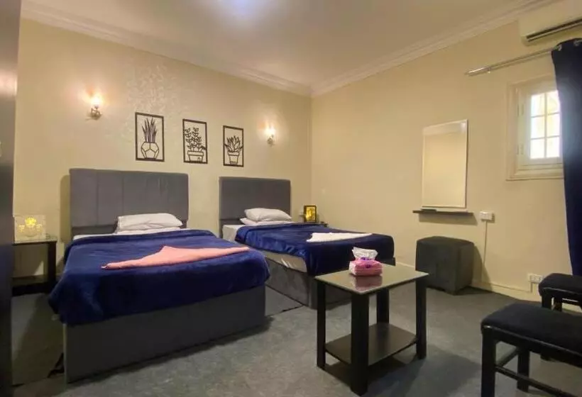 تختخواب و صبحانه Seven Pyramids View Inn