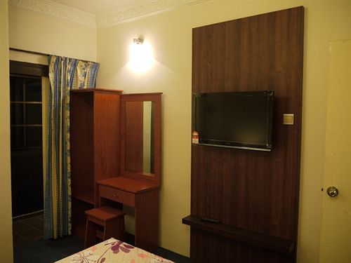 Отель Camellia Budget Inn