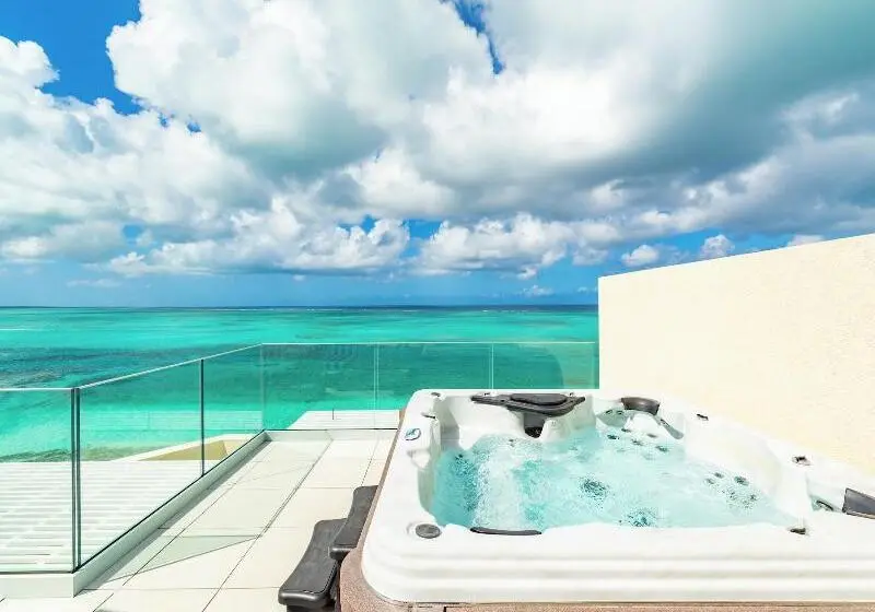 هتل Beachfront At Windsong On The Reef