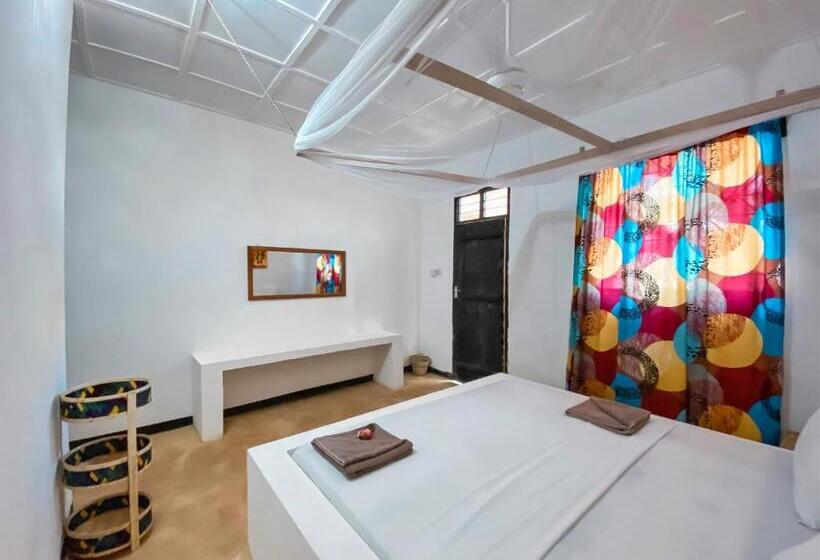 בית מלון כפרי Papaya Guest House Nungwi