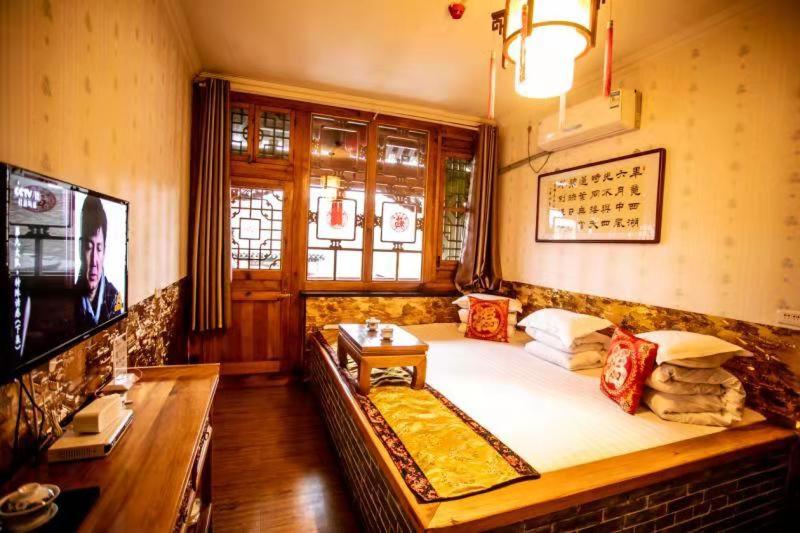 הוסטל Pingyao Deyunshe Inn