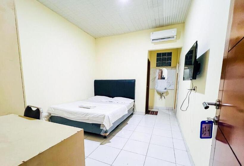 Отель Taisir Residence Near Palmerah Mitra Reddoorz