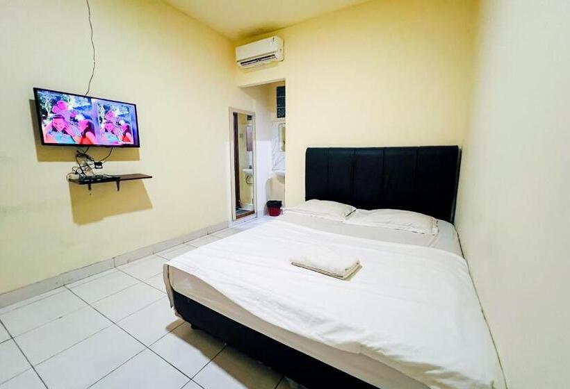 Отель Taisir Residence Near Palmerah Mitra Reddoorz