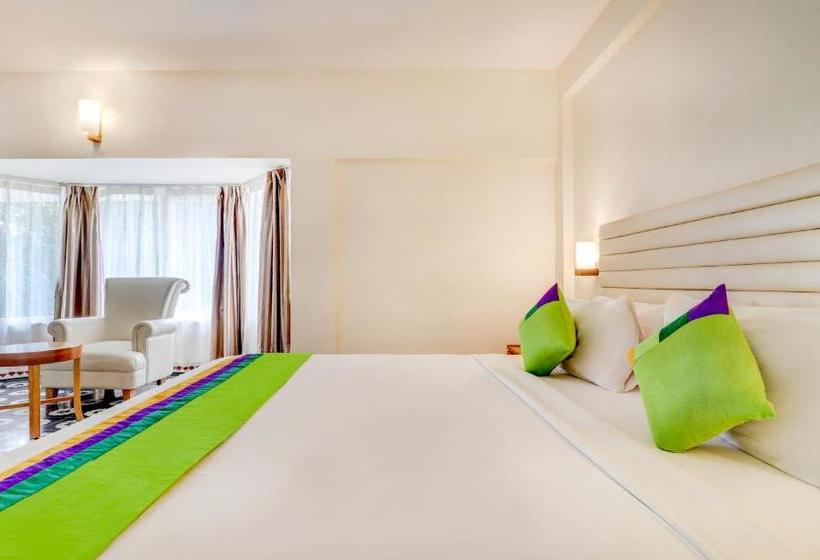 Отель Treebo Trend Palmyra Grand Suites