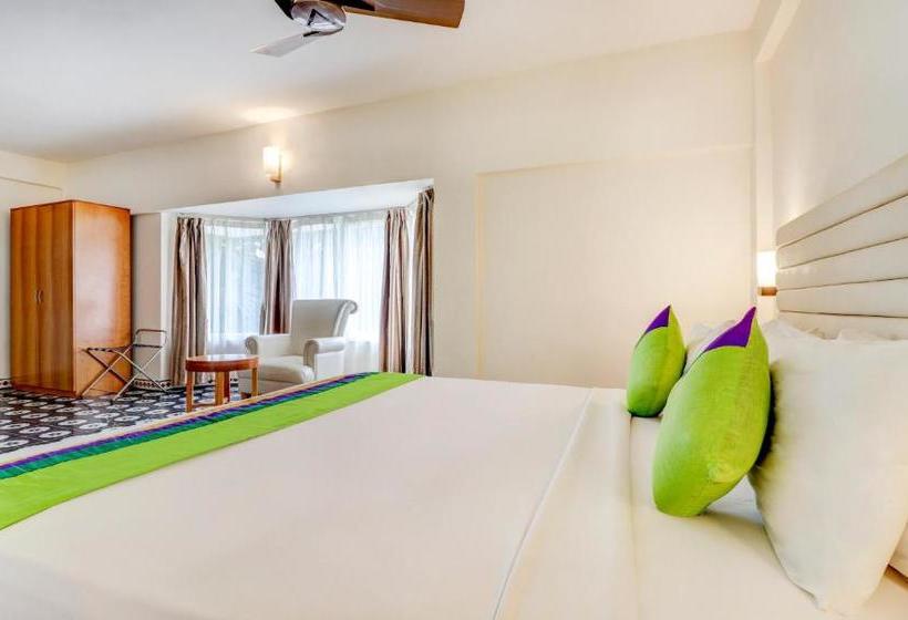 Отель Treebo Trend Palmyra Grand Suites