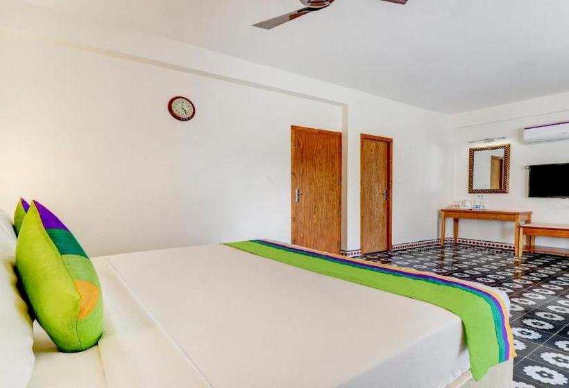 Отель Treebo Trend Palmyra Grand Suites