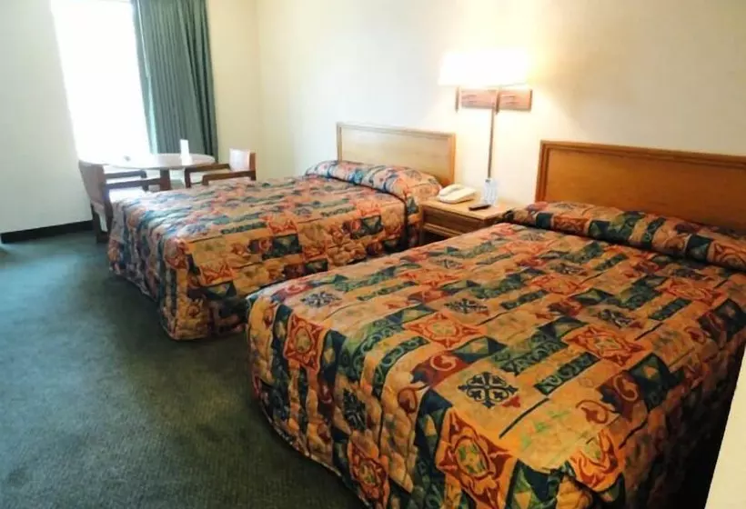 Отель Travelers Inn & Suites