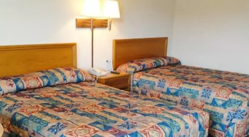 Отель Travelers Inn & Suites