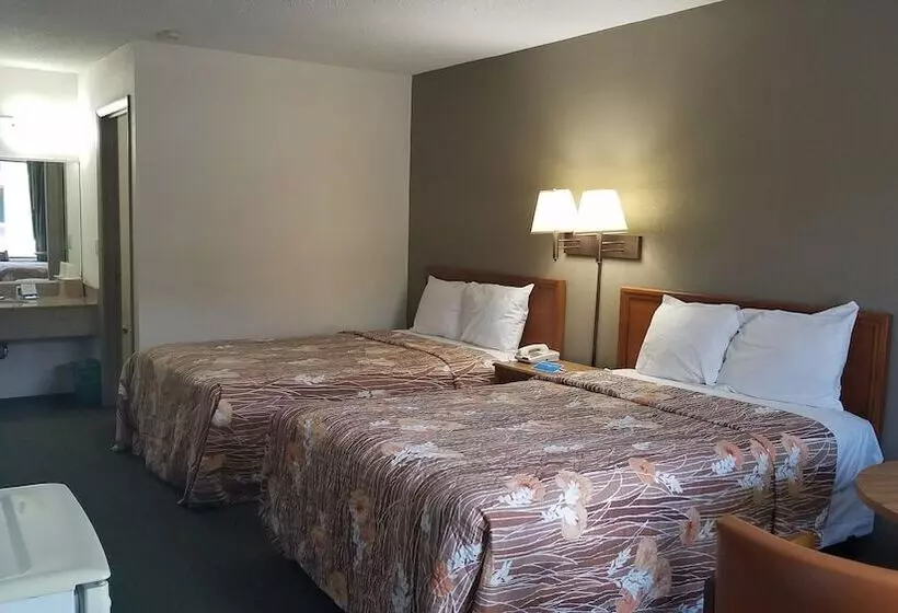 Отель Travelers Inn & Suites