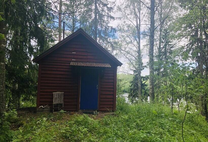 Tiny Hut In The Forest Overlooking The River