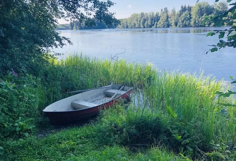 Tiny Hut In The Forest Overlooking The River