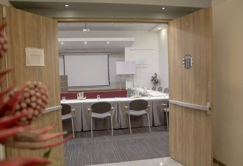 Отель Novelty Suites