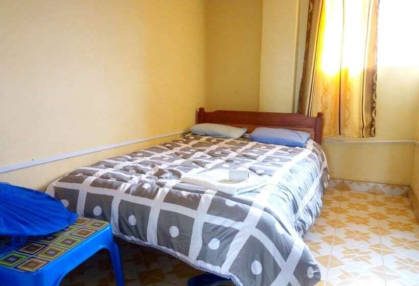 هتل At Ease Guest House