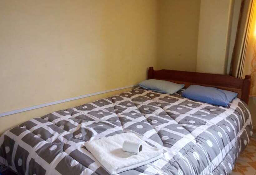 هتل At Ease Guest House