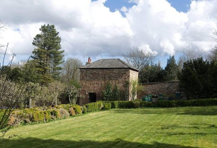 A Quirky Garden Building In An Orchard