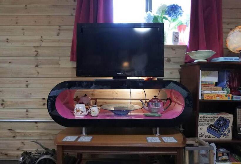 A Quirky Garden Building In An Orchard