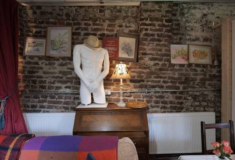 A Quirky Garden Building In An Orchard