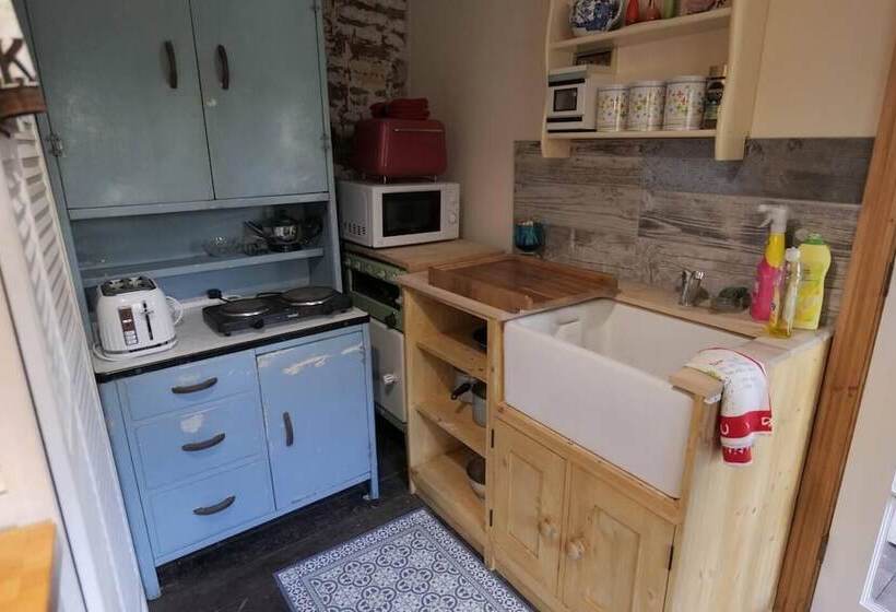 A Quirky Garden Building In An Orchard