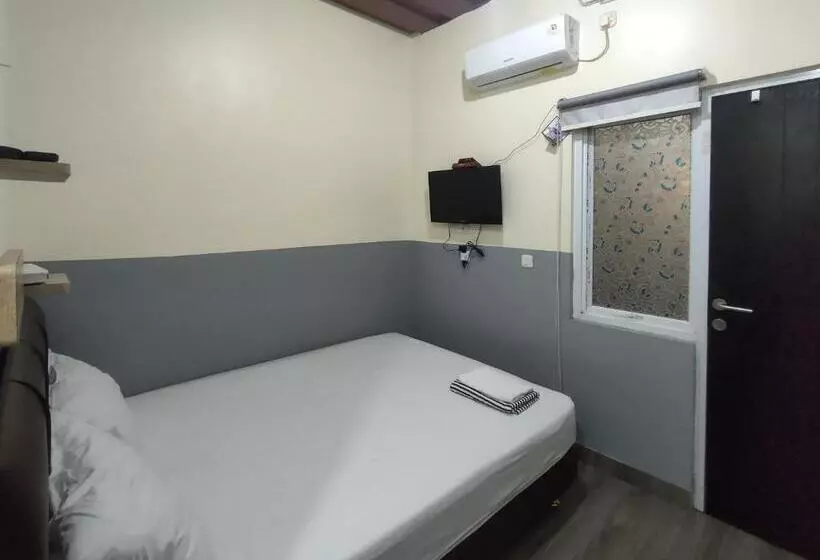 Hotelli Puspiptek Residence Syariah Mitra Reddoorz