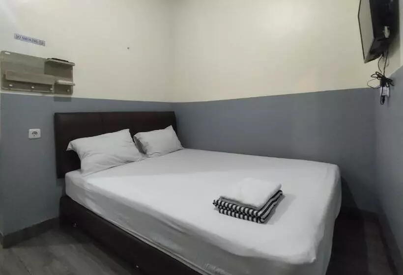 Hotelli Puspiptek Residence Syariah Mitra Reddoorz