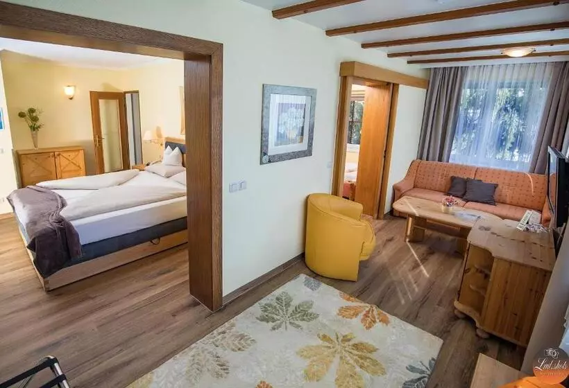 اتاق خانوادگی با چشم‌انداز باغ, Flairhotel Am Wörthersee