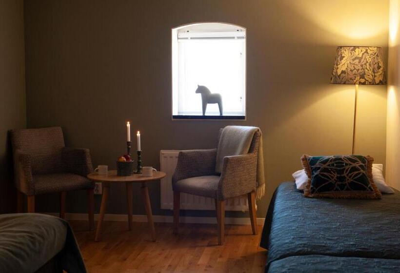 غرفة عائلية, L Magasin 1