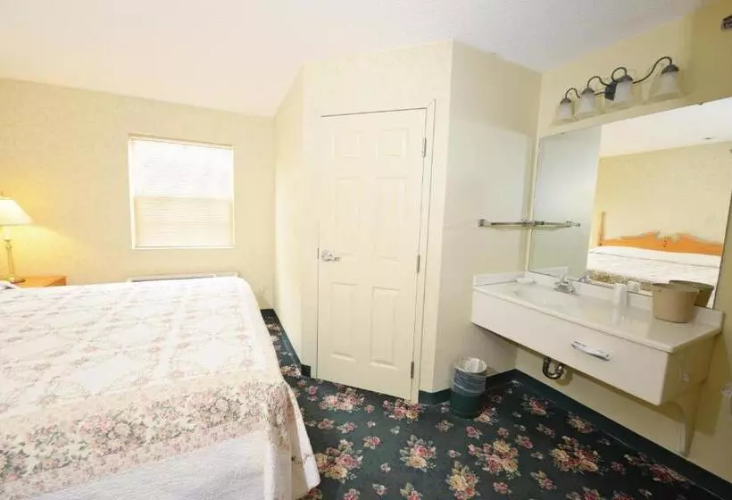 キングサイズベッドのスタンダードルーム, Our Guest Inn And Suites   Downtown