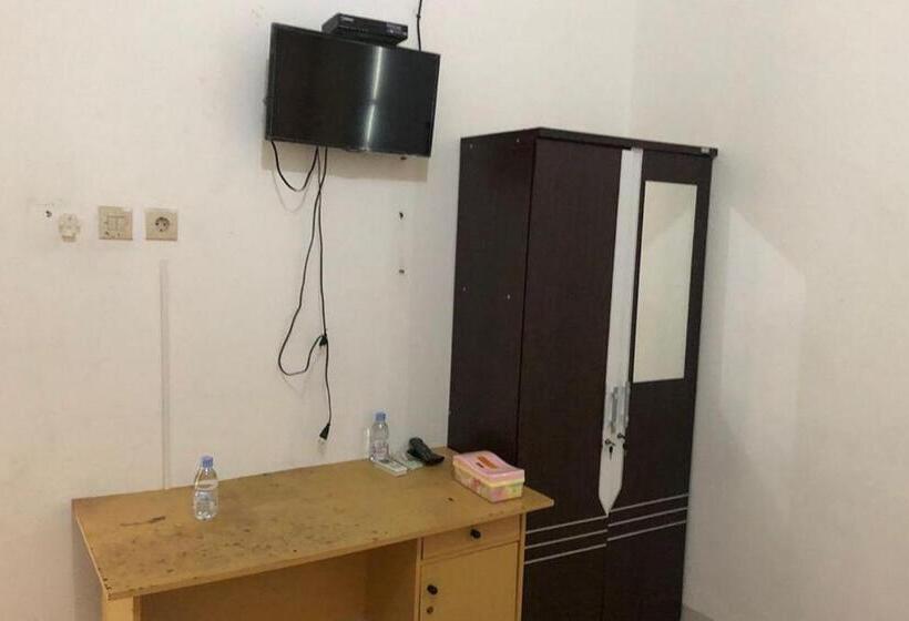 Номер Deluxe, Wisma Gardenia Palangkaraya Syariah Redpartner