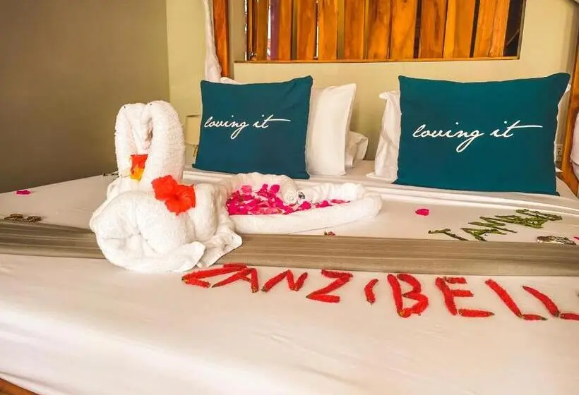庭の見えるスタンダードトリプルルーム, Zanzibella Hotel & Spa