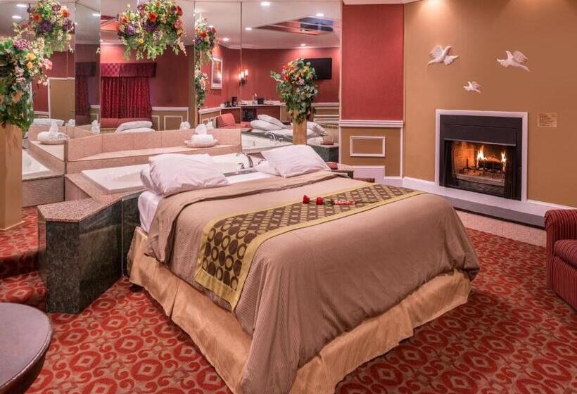 מיטת קינג בסוויטה, Inn Of The Dove Romantic Luxury & Business Suites