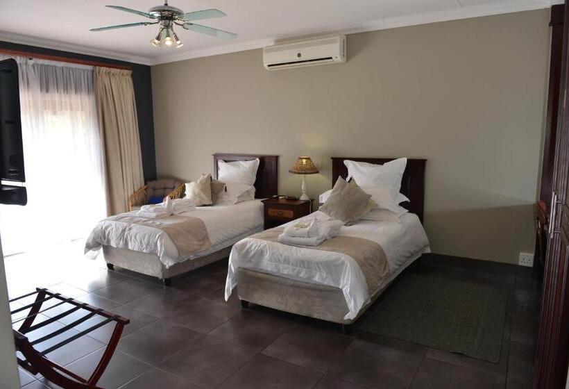 Quarto Deluxe, Cornerstone Guest Lodge