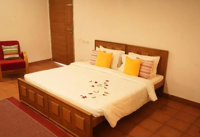 キングサイズベッドのスタンダードルーム, Niraamaya Retreats Vaidekam, Kannur