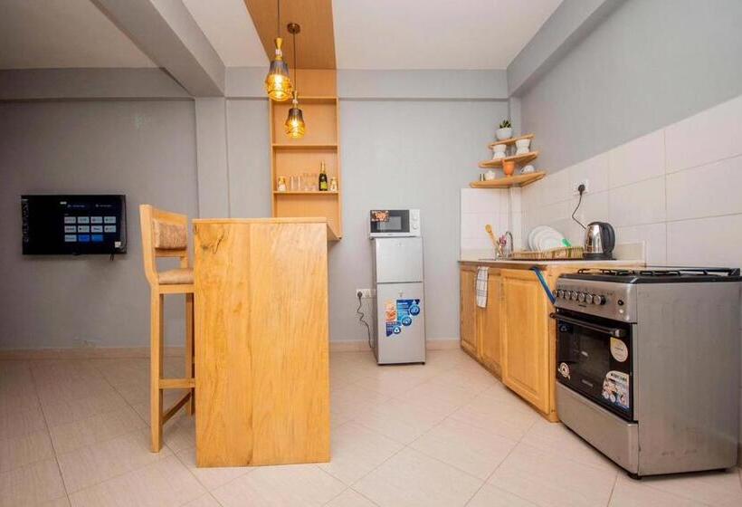 キングサイズベッドのデラックスルーム, Riverpoint Inn, Arusha