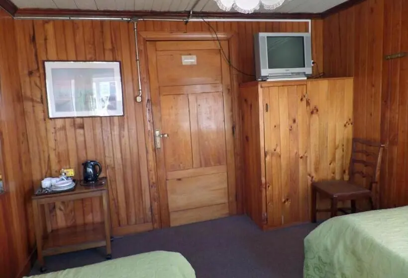 اتاق استاندارد سه تخته با سرویس بهداشتی مشترک, Hostal Y Cabañas Villa Germana