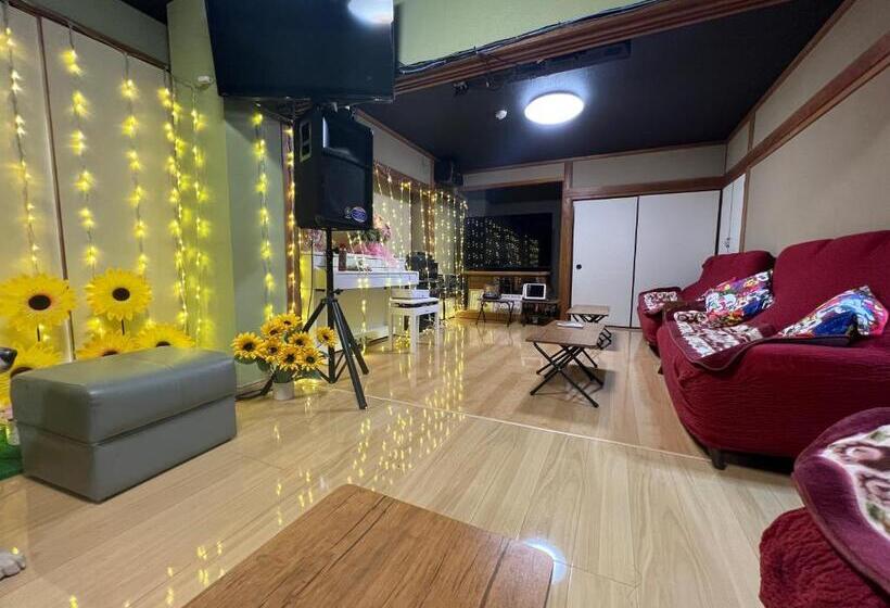 سرير فى غرفة مشتركه, ゲストハウス　アロマ