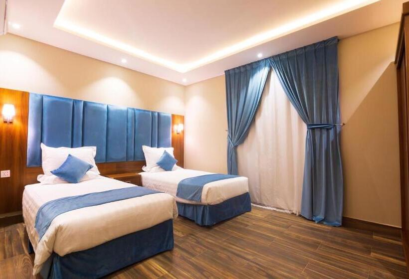 デラックスジュニアスイート, أجنحة بالم تري للشقق المخدومه