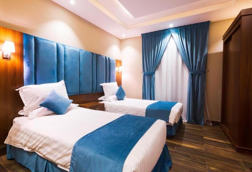 デラックスジュニアスイート, أجنحة بالم تري للشقق المخدومه