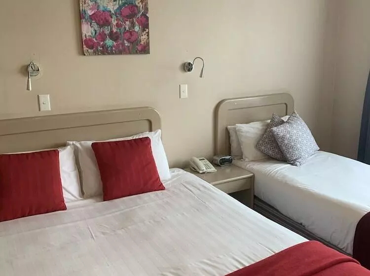 スタンダードスタジオ, Asure Camelot Arms Motor Lodge