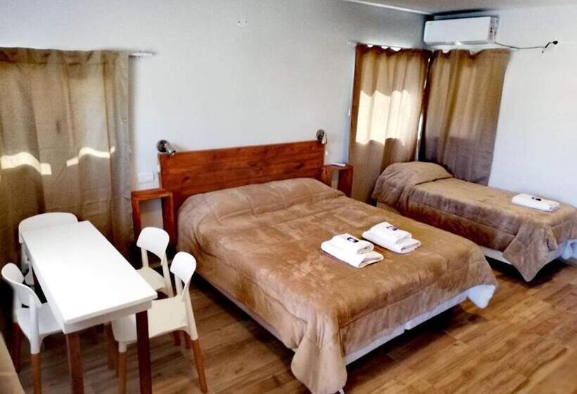 غرفة ديلوكس رباعية, Raíces