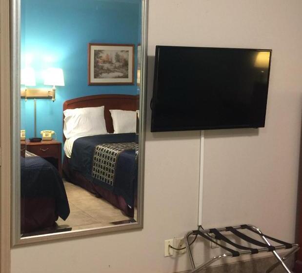 キングサイズベッドのデラックスルーム, Texas Inn And Suites City Center At University Dr