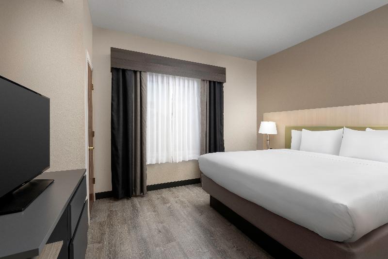 מיטת קינג בסוויטה, Country Inn & Suites By Radisson, Gainesville, Fl