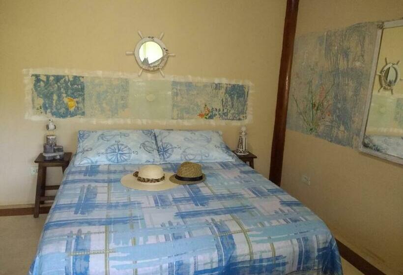 Quarto Triplo Estandar com Sacada, Manacá Suítes Prumirim