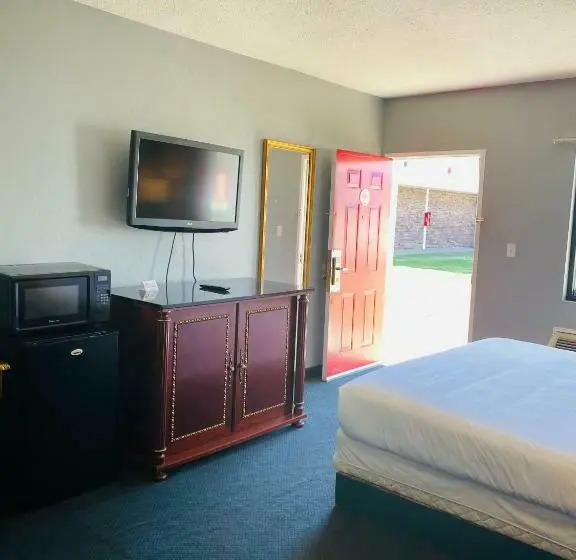キングサイズベッドのスタンダードルーム, Traveler's Place Inn & Suites