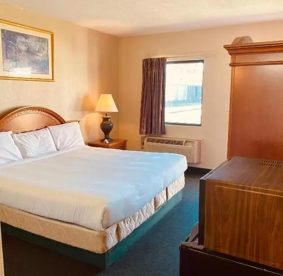 身障者適用キングサイズベッドルーム, Traveler's Place Inn & Suites