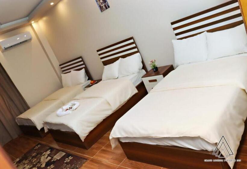 اتاق خانوادگی با چشم‌انداز باغ, Luca Pyramids Inn